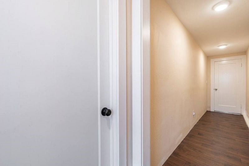 Semi Private Hallway. Hosts will access hallway infrequently to take trash in/out and carry large items to the street such as surfboards. The host is a surfer. 