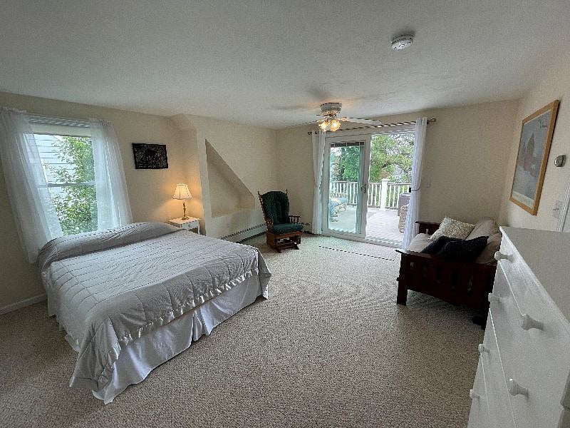 Large master bedroom on second floor with sliding door to 150 sqft deck