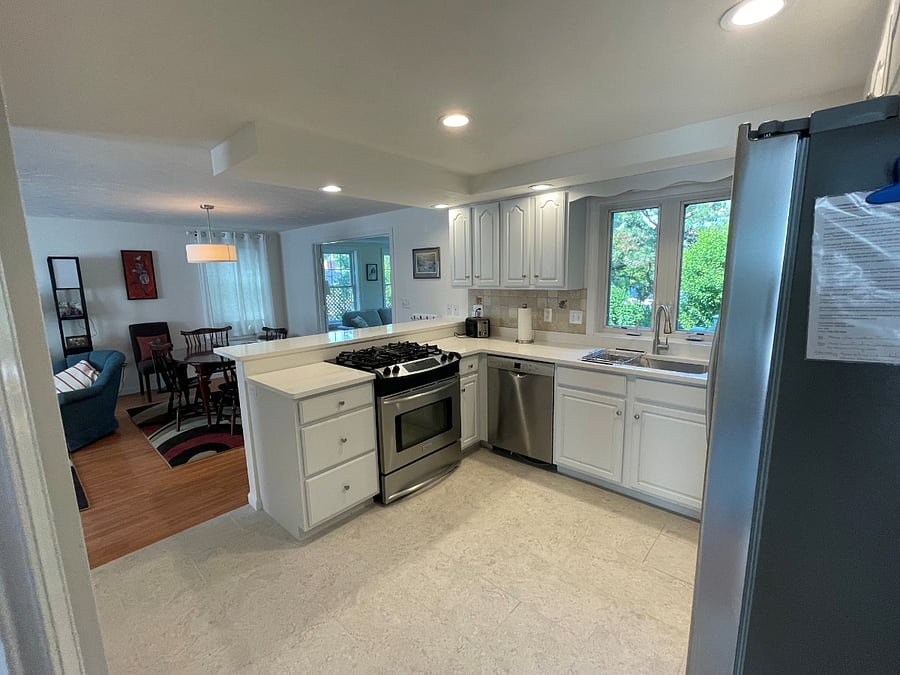 Full kitchen with gas stove, new granite counter, and new stainless steel appliances