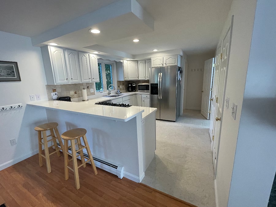 Full kitchen with gas stove, new granite counter, and stainless steel appliances