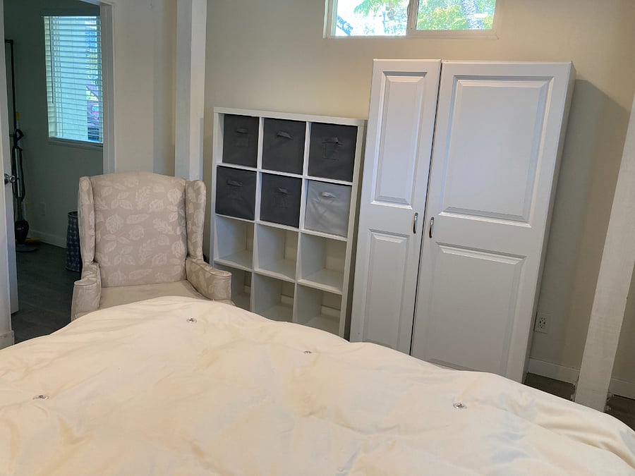 Bedroom chair, cubbies and wardrobe