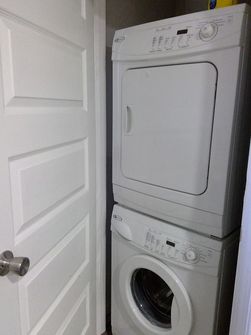 Large size washer and dryer in hallway closet