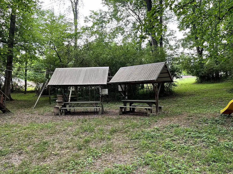 Guests love our covered picnic tables with lights, a fan, and power outlets!