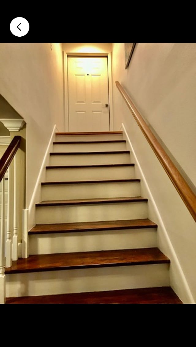 Stairs to the flat with a locking door to the second floor 