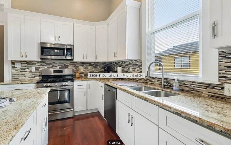 Marble top counters, modern appliances and a gas top stove