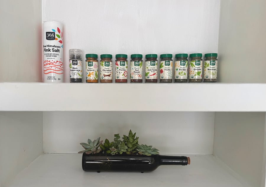 Organic spice set can be found in the middle kitchen cabinet