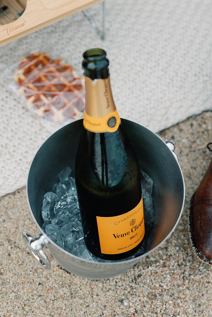 This picnic basket, table, champagne/wine bucket, blanket, glasses, and plants are provided for guests to enjoy. Its the setup we used on our engagement day, and wed love for you to explore and experience the coastline with it as well.