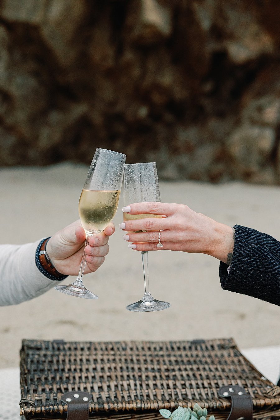 This picnic basket, table, champagne/wine bucket, blanket, glasses, and plants are provided for guests to enjoy. Its the setup we used on our engagement day, and wed love for you to explore and experience the coastline with it as well.