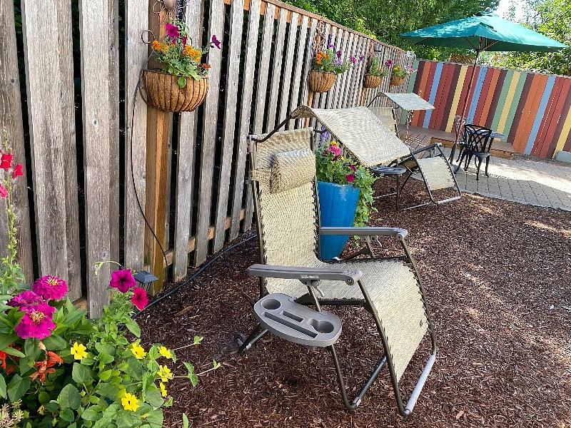 Back yard loungers and flowers