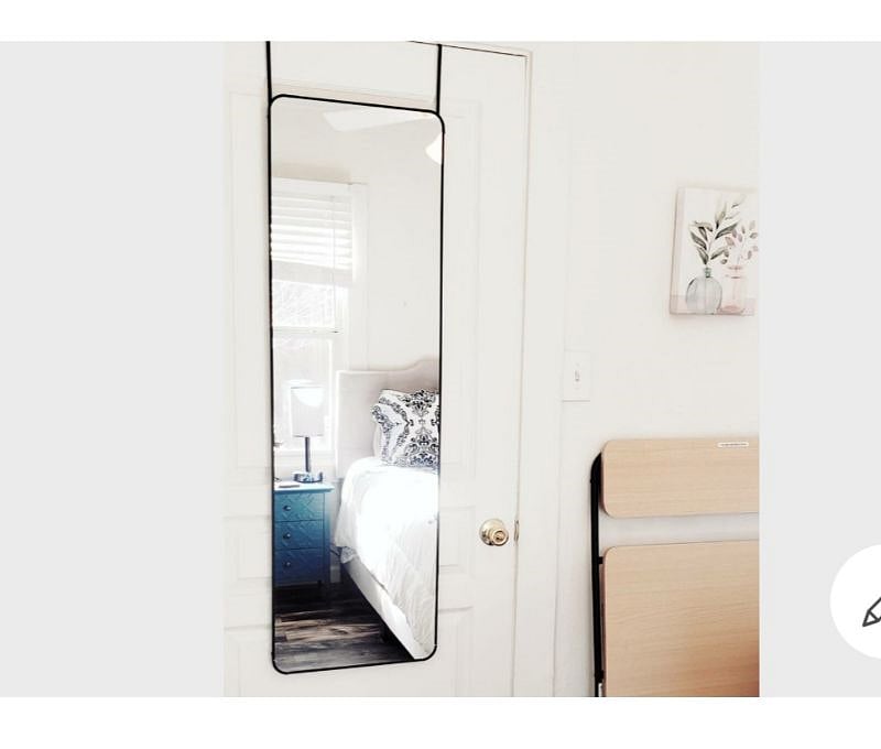 Full length mirror behind bedroom door