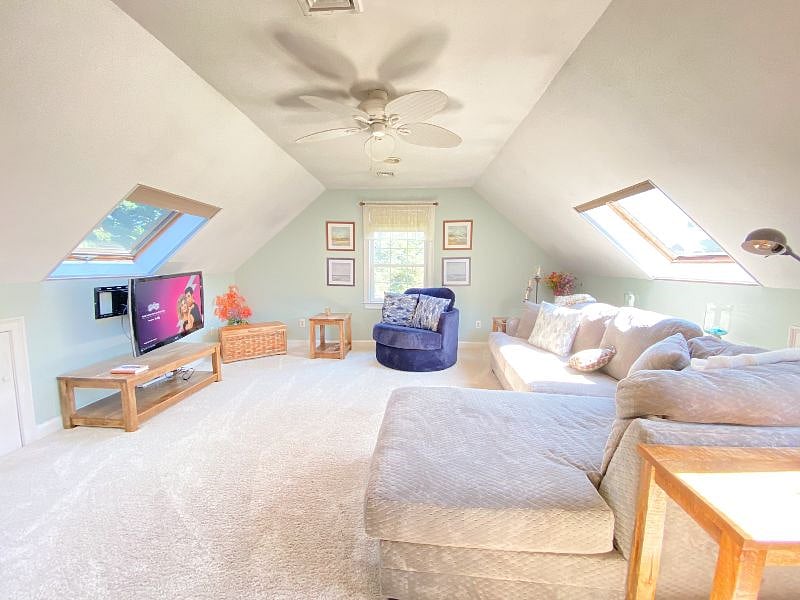 2nd Floor Den, from the top of the stairs. Sectional sofa on the right and double chaise on the left