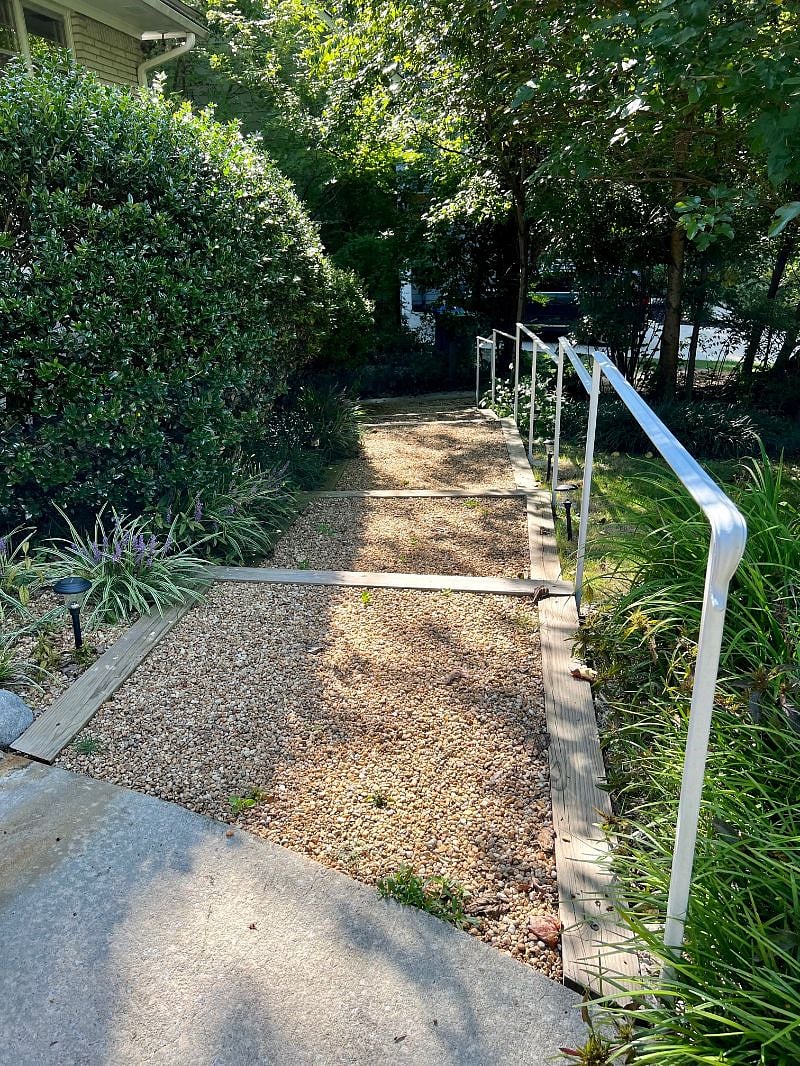 Pathway to entrance of terrace level apartment. 