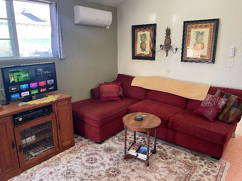 Living Room space has comfy couch and tv with Apple TV, Netflix and wifi.