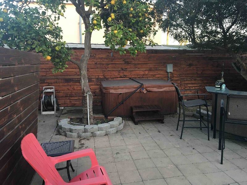 Shaded hot tub and bar-- a nice spot to chill out and enjoy some R&R.