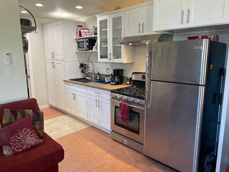 Kitchen has a full oven/range, large refrigerator and all the essentials.
