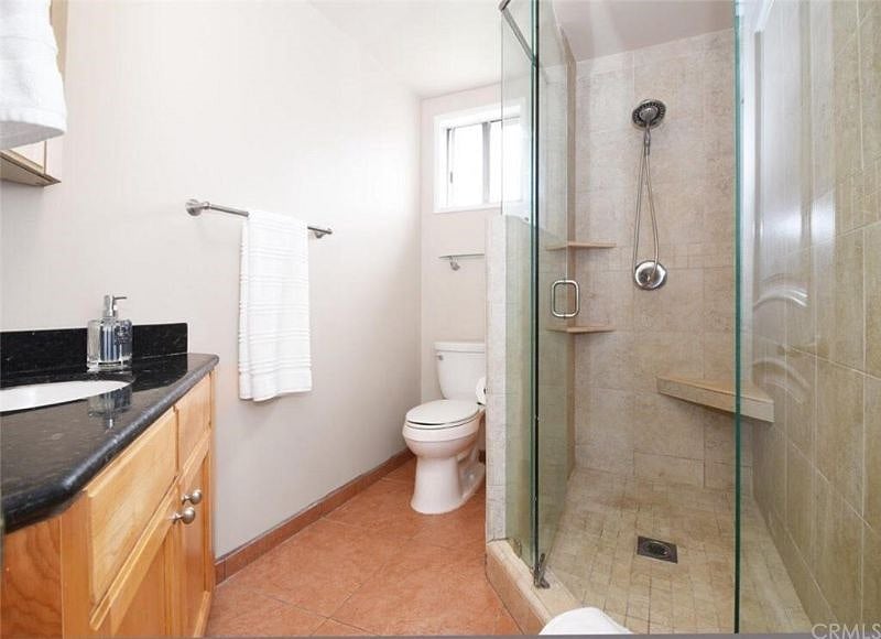 Bathroom has a roomy walk-in shower.