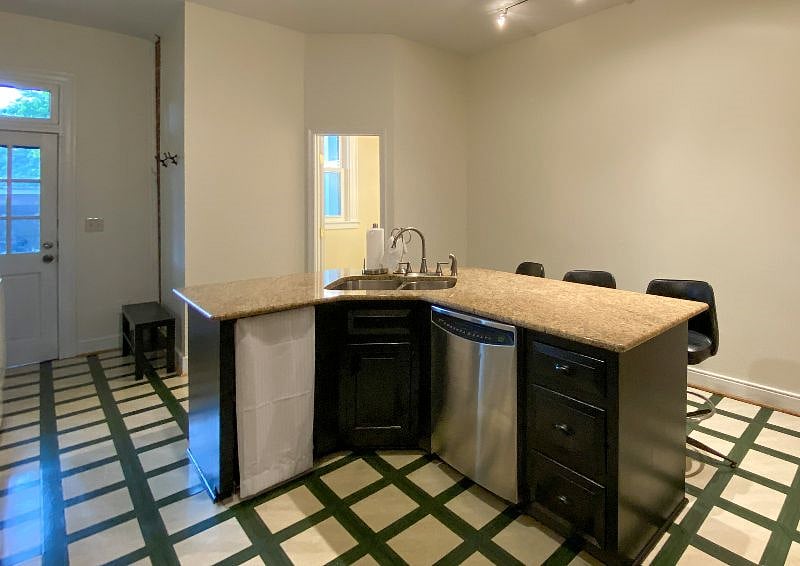 Island with sink and dishwasher.