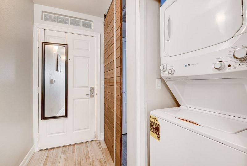 Full size stackable washer and dryer in unit