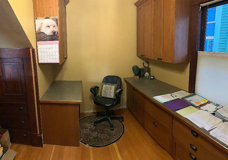 Office space with two desks and many drawers and cabinets