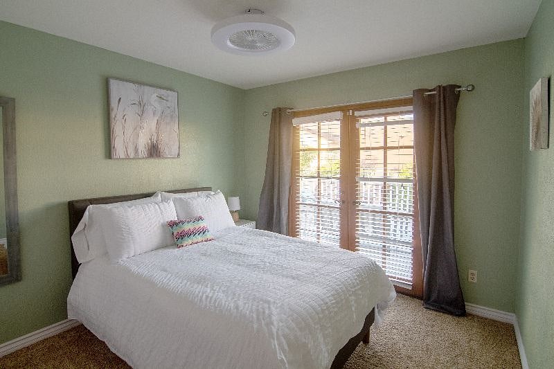 Upstairs #3 Full Bedroom with french doors leading to deck access
