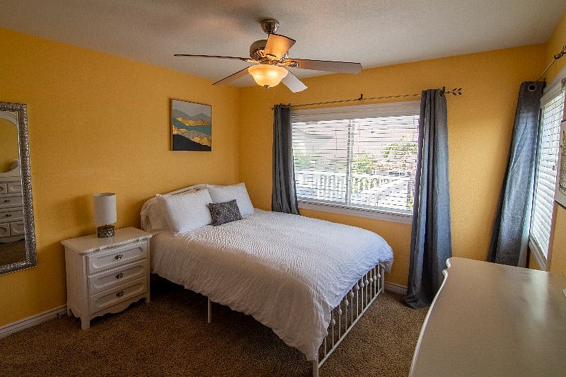 Upstairs #4 Queen Bedroom with large windows and huge closet (not pictured)
