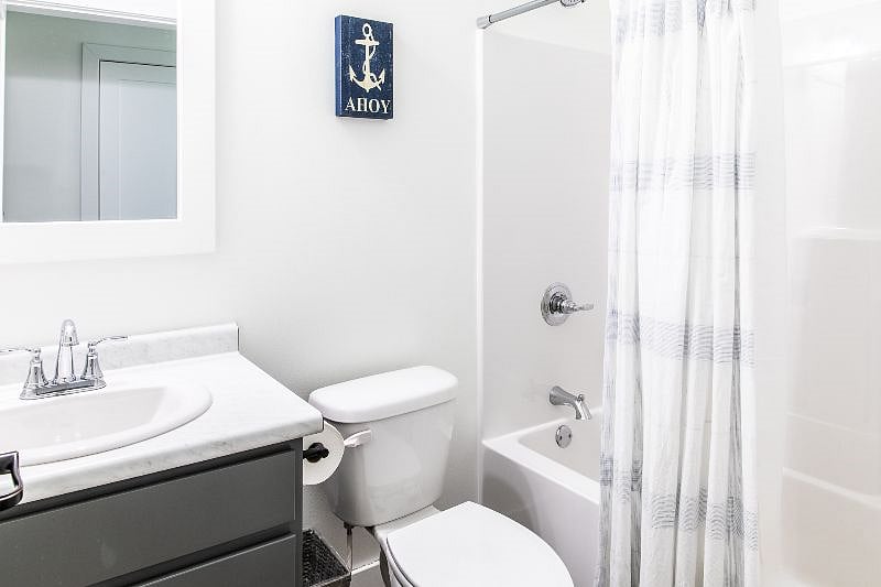 Hall bath with shower and bath tub.