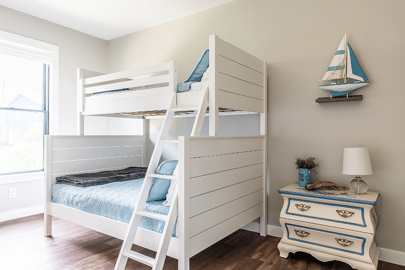Twin over full bunk beds, closet, and blackout shades in Bedroom 2.