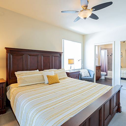 Primary Bedroom w Smart TV on wall