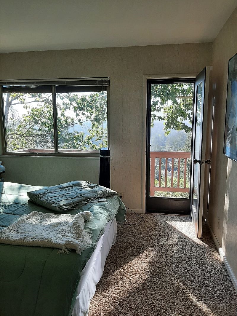 Sunny bedroom view/door to shared balcony