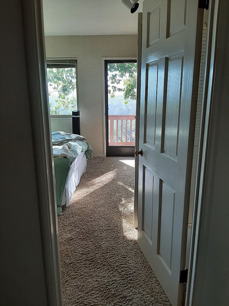 Entrance to 2nd sunny bedroom with door to upper deck