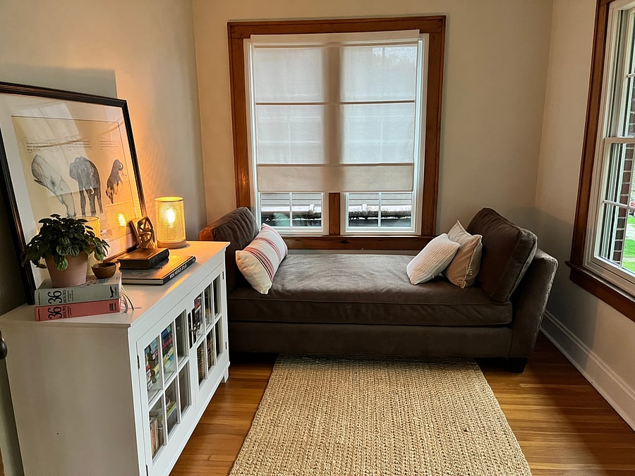 Sitting behind original French doors just off the living room is a charming reading room with twin size daybed.