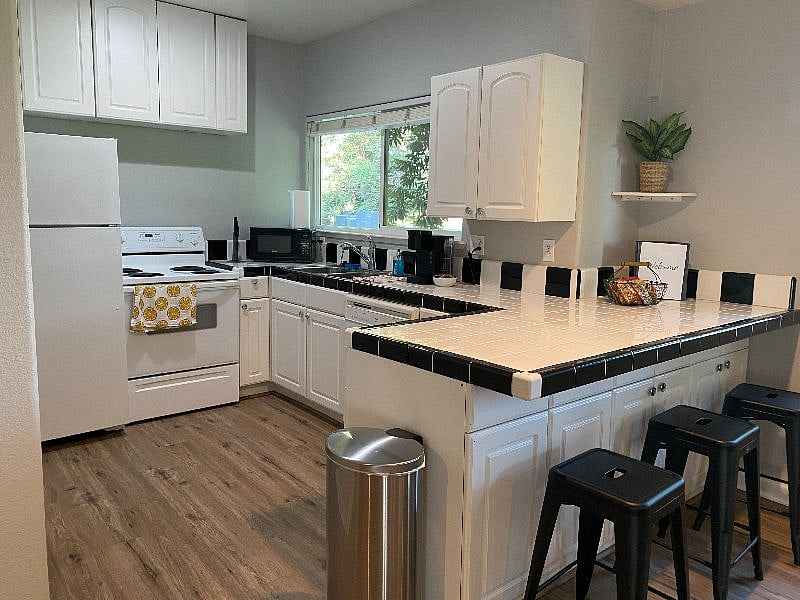 The kitchen has a full size refrigerator, stove/oven and dish washer.  It also comes fully stocked with pots/pans, dishes/silverware, a Keurig, toaster and microwave.