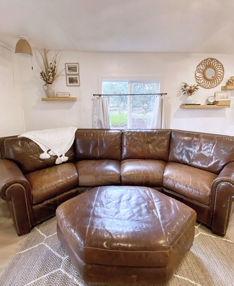 Beautiful leather sofa to relax and enjoy the electric fireplace and tv