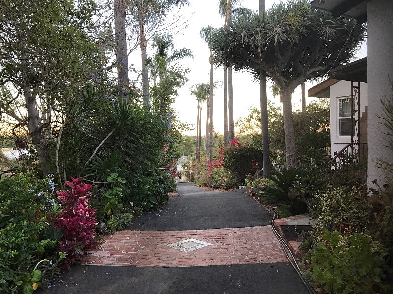 Separate guesthouse sits at the top of the hill ,the two acres estate is fenced with an electric automatic gate.