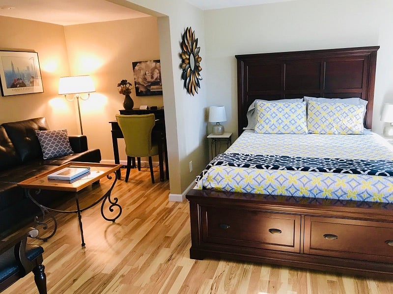 Super comfy Tuft N Needles mattress with four pillows. Two large drawers at the foot of the bed