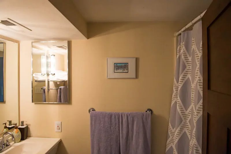 Bathroom has full shower with tub.