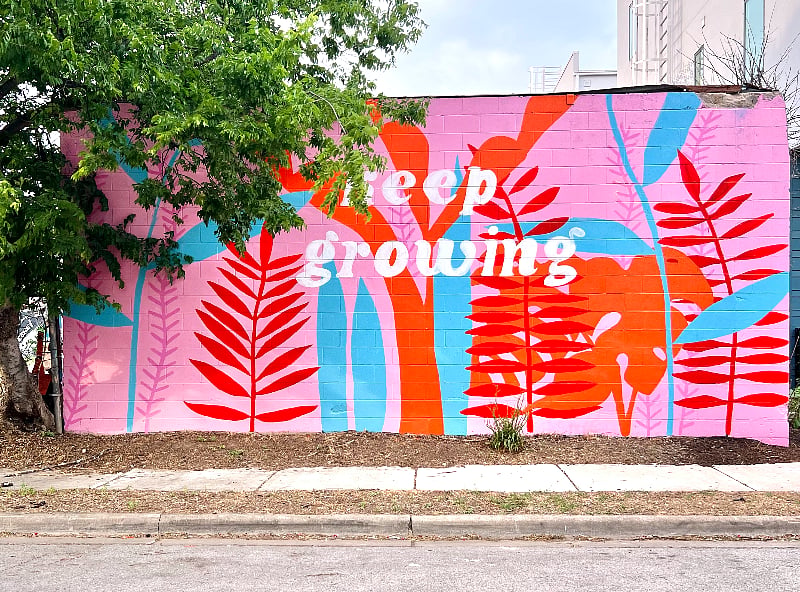 You can tell your guests to park next to the mural! It's a landmark that's right next to the building.