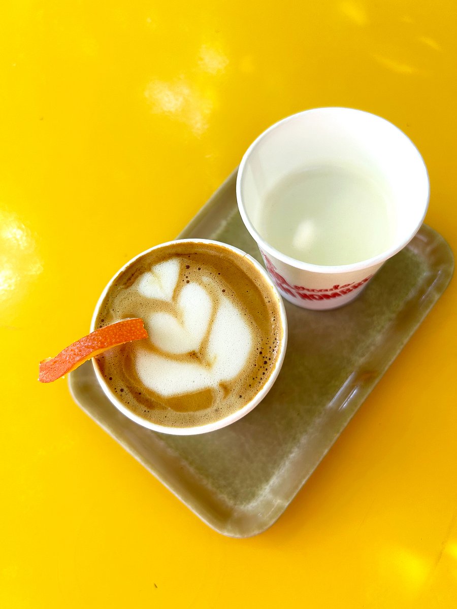 Cafe Sin Nombre, one of Austin's best coffee shops, is at the end of the building.