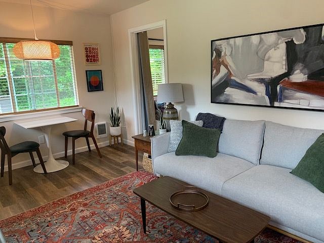 Living area - couch and bedroom entrance. 