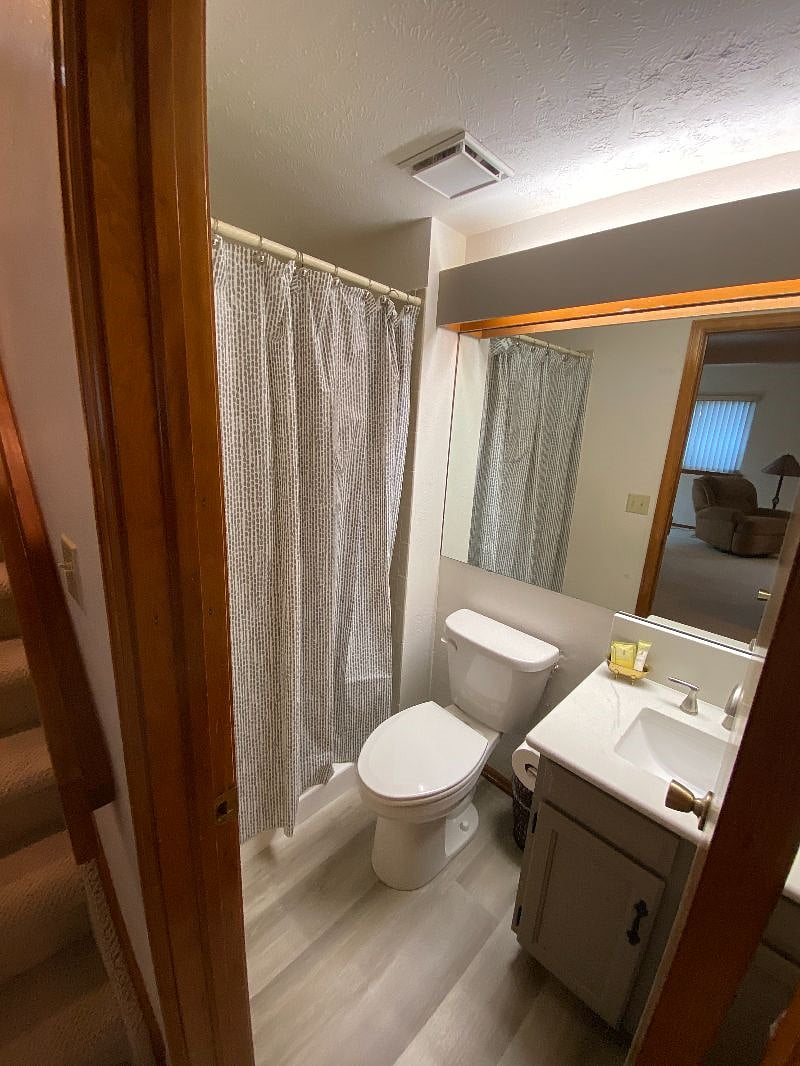 Finished Basement Bathroom, New Vinyl Flooring, Shower.
