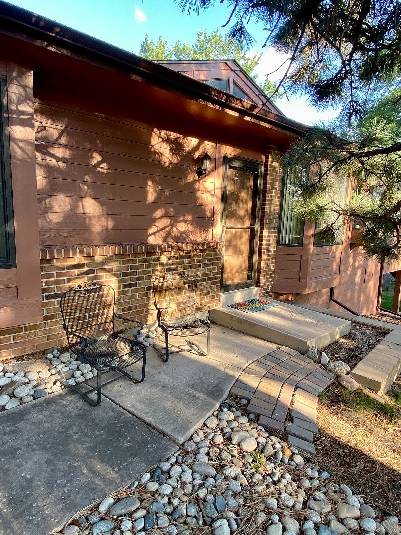 Front Door Entry West Side.  Lounge Chairs out Front. 