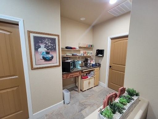Cantina area with coffee bar, toaster and microwave that also air fries