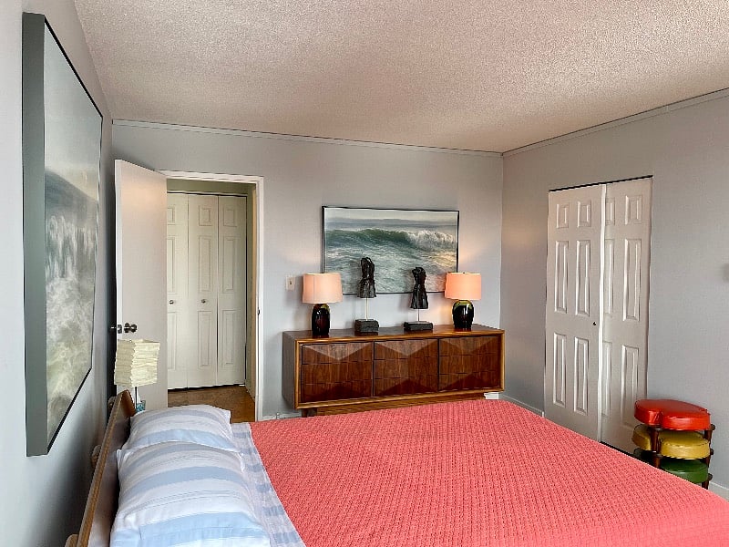 Designer furniture by Design within Reach and other collectibles. Museum-level fine art create a relaxing sea- inspired bedroom. Black out shades for sleeping any time of day! Mattress is only 2 years old.