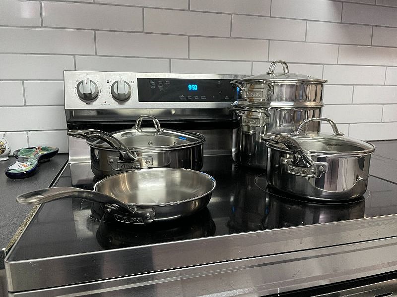 Samsung stove alongside Viking stainless steel cookware