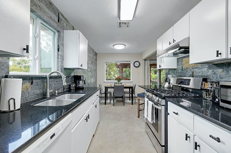 Kitchen with coffee maker, french press, teapot, microwave,toaster, and lots of kitchen tools for cooking