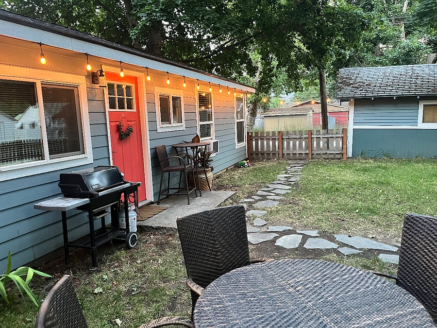 Fenced yard, off-street parking at side of home.