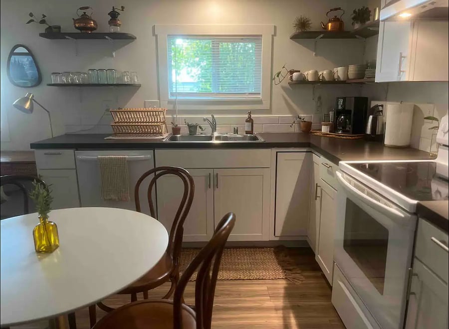 Dishwasher, stove, refrigerator, and microwave.