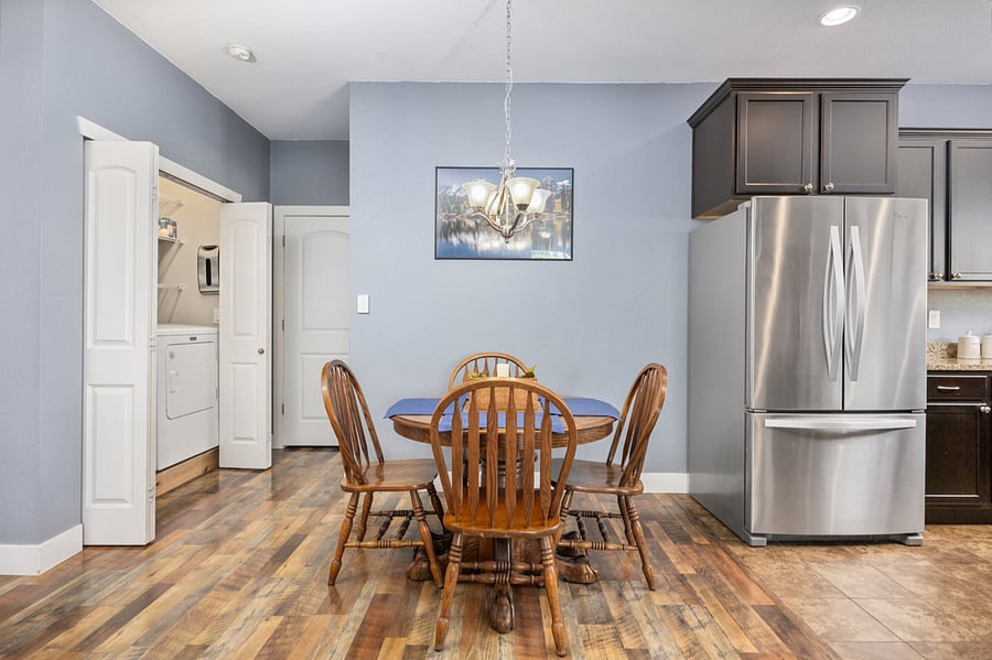 Dining Room with solid oak table and 4 chairs, with an extension leaf and additional chairs available to make this a table for 6.