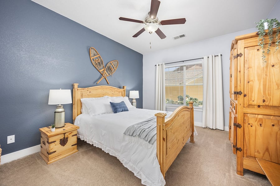 Primary bedroom with Queen Bed, and matching with 32" TV and Firestick 