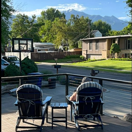 Deck adirondack chairs looking at mountains